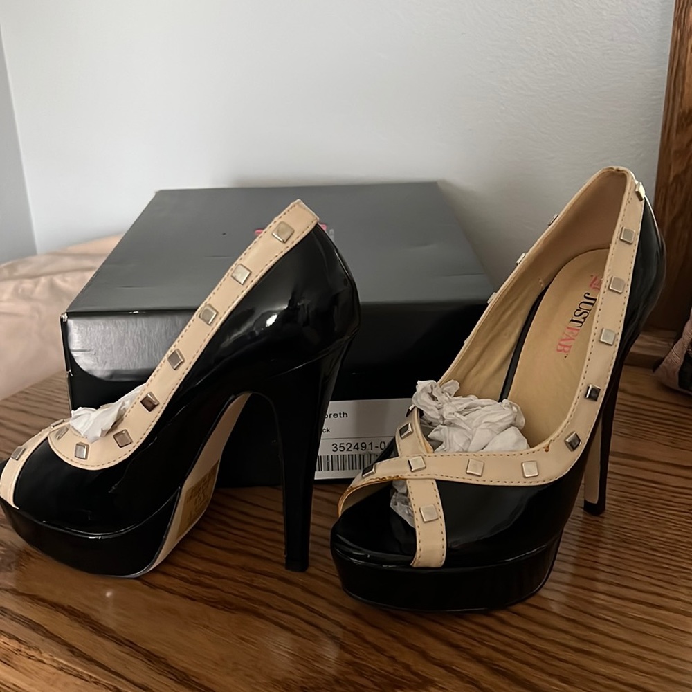 Size 6.5. New never worn.  Black with cream accent 4 inch heel 1 inch platform